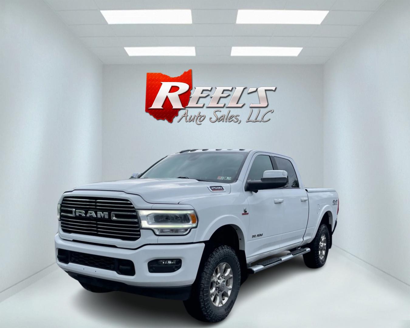 2020 White /Black RAM 2500 Laramie Crew Cab SWB 4WD (3C6UR5FL7LG) with an 6.7L I6 OHV 24V TURBO DIESEL engine, 6A transmission, located at 11115 Chardon Rd. , Chardon, OH, 44024, (440) 214-9705, 41.580246, -81.241943 - This 2020 Ram 2500 Laramie Crew Cab is a powerhouse pickup truck designed for serious towing and hauling capabilities. Under the hood lies a 6.7L Cummins Turbo Diesel engine mated to a 6-speed 68RFE transmission with 3.73 gearing, producing an impressive 370 hp and a staggering 850 lb-ft of torque. - Photo#0